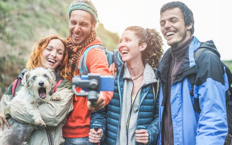 happy trekkers people making video vlog with gimbal phone young hiker friends having fun mountain excursion day technology trends sport concept main focus center guys faces 1