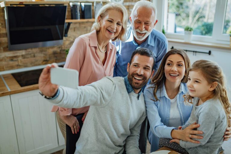 cheerful multigeneration family taking selfie having fun together home 768x512 1