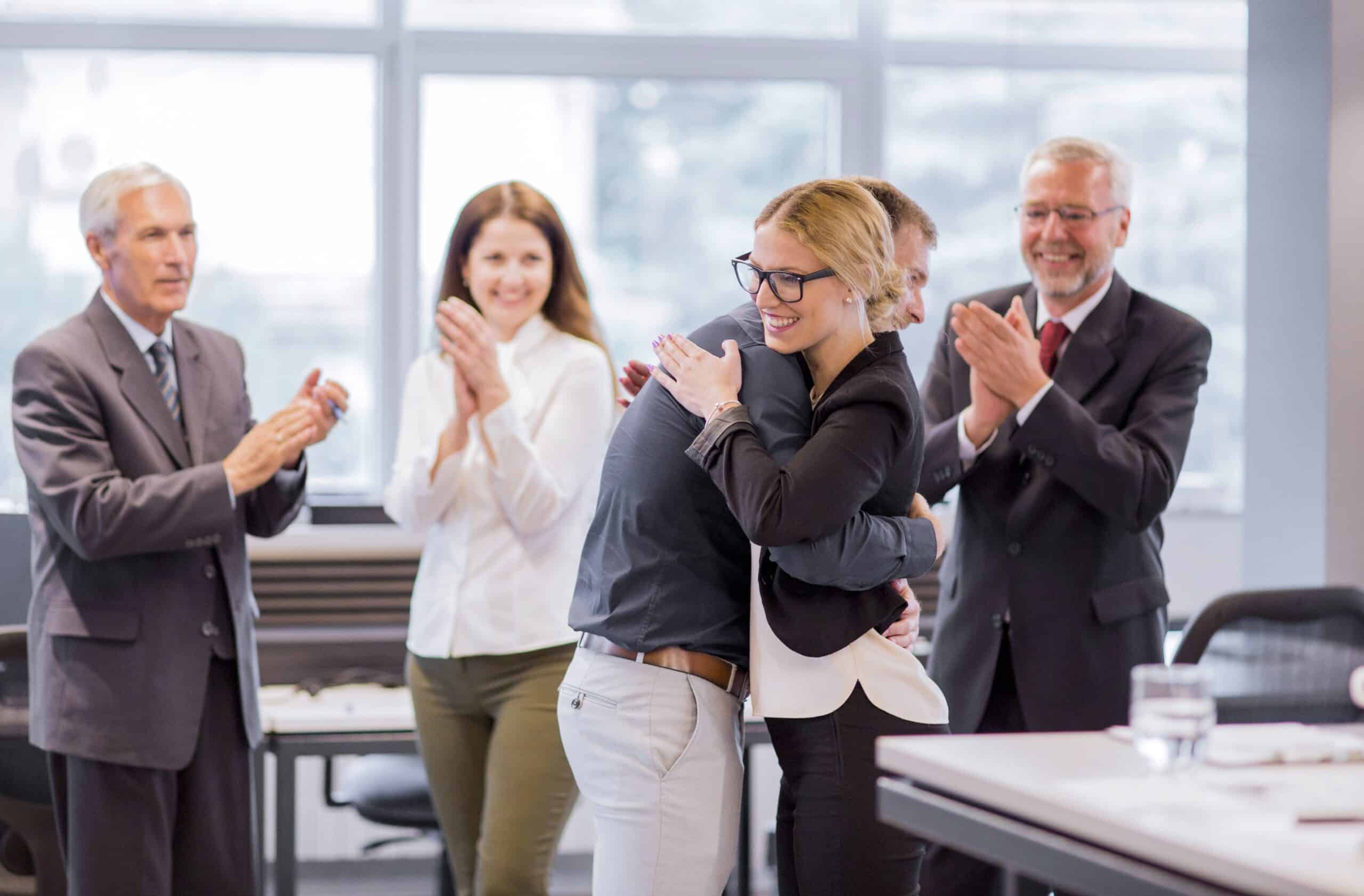 business people team applauding achievement min scaled