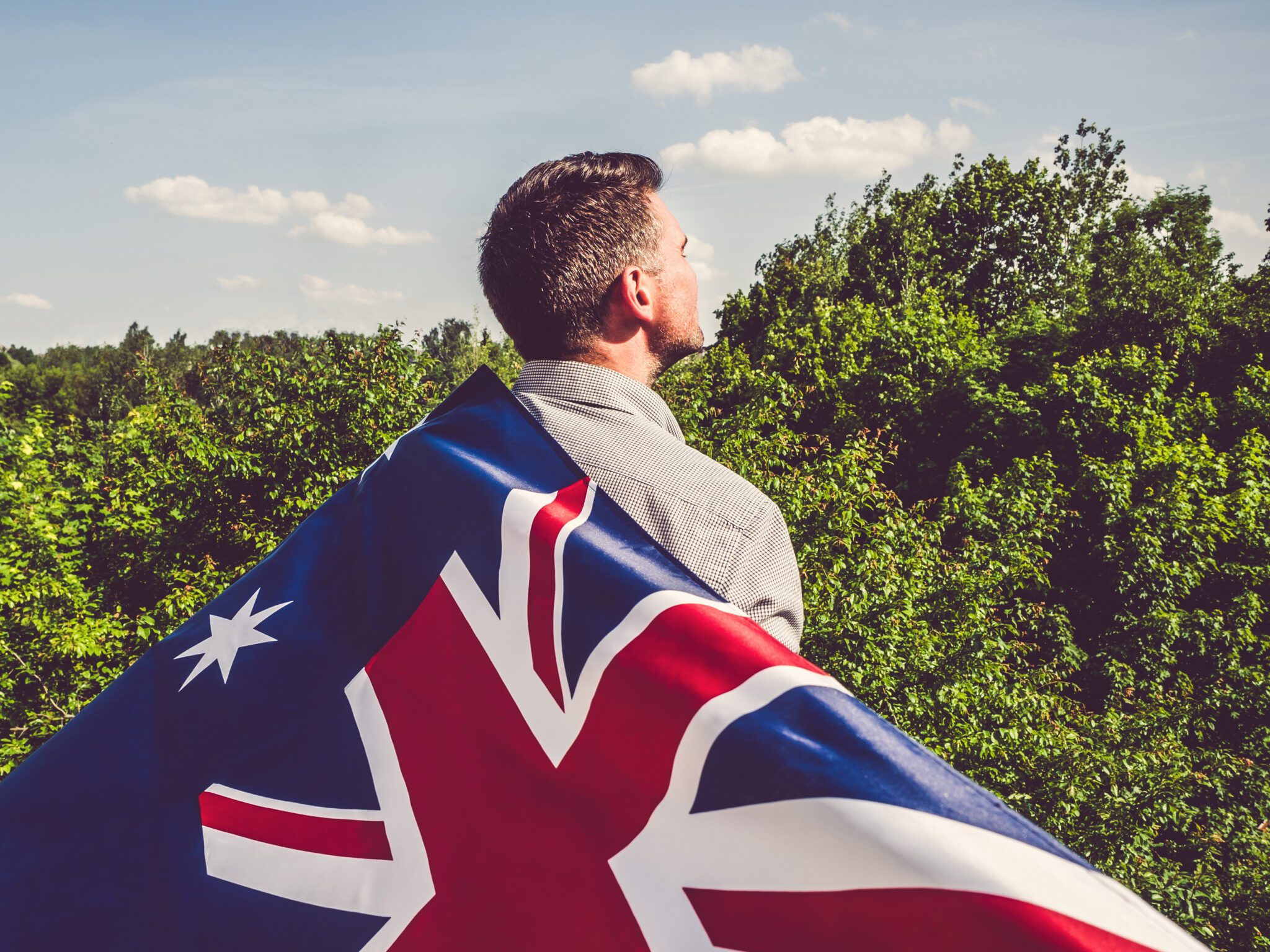 handsome man holding australian flag 2048x1536 1