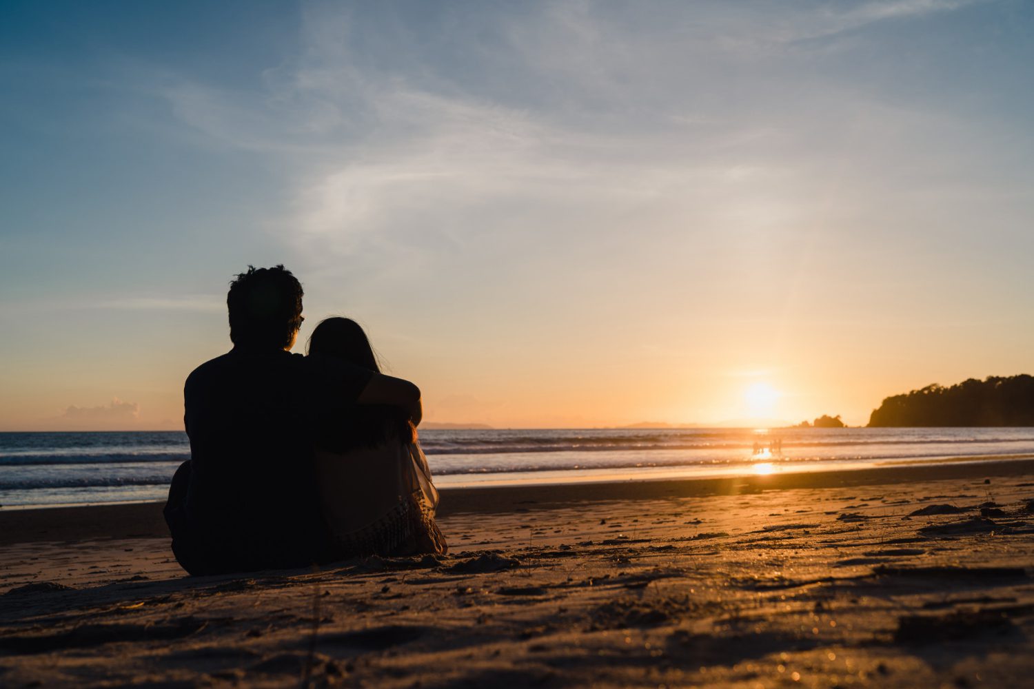 young asian couple watching sunset near beach sweet couple happy relax enjoy love romantic moment